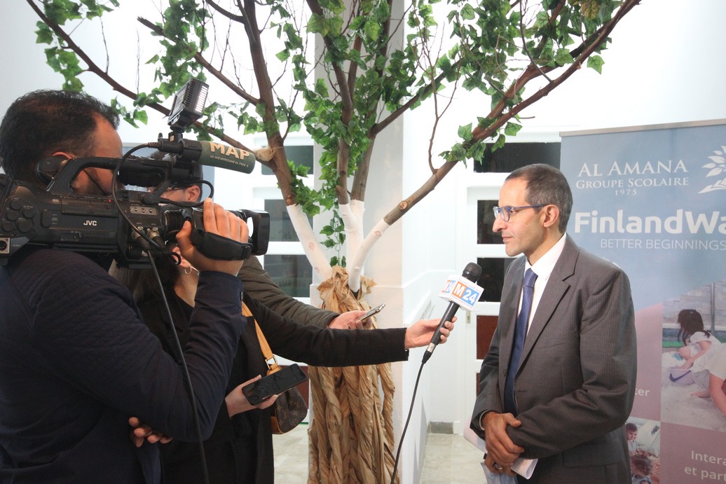 School director Younès Alaoui giving interview to TV in the school inauguration event